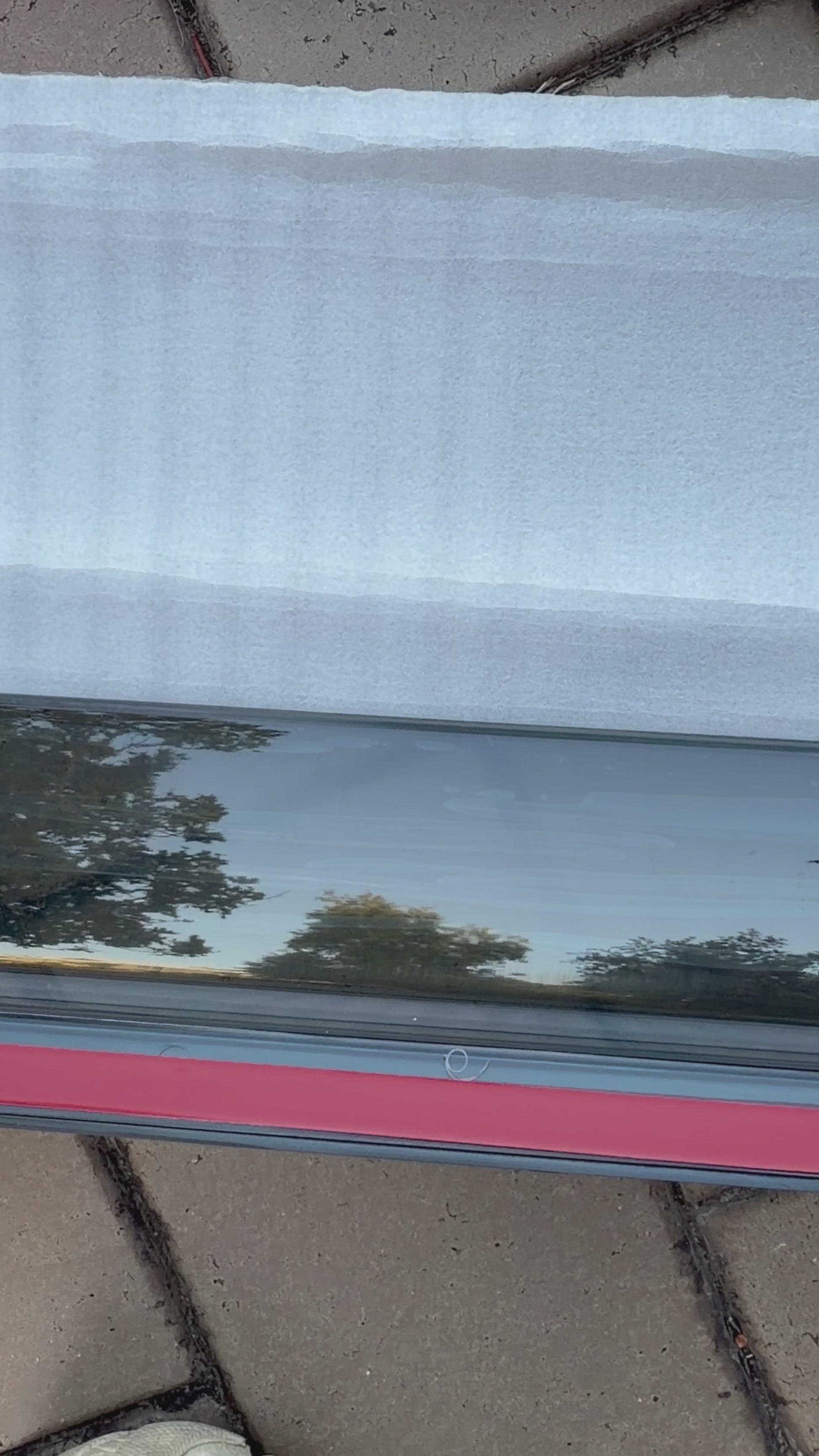 Close up of Iron Devil brand BYD Shark 6 window visor on tile