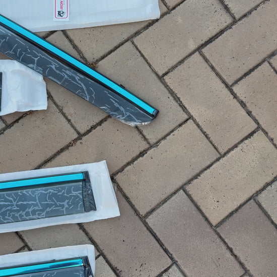 Panning shot 4 BYD Shark 6 window visors Iron Devil Brand on tile