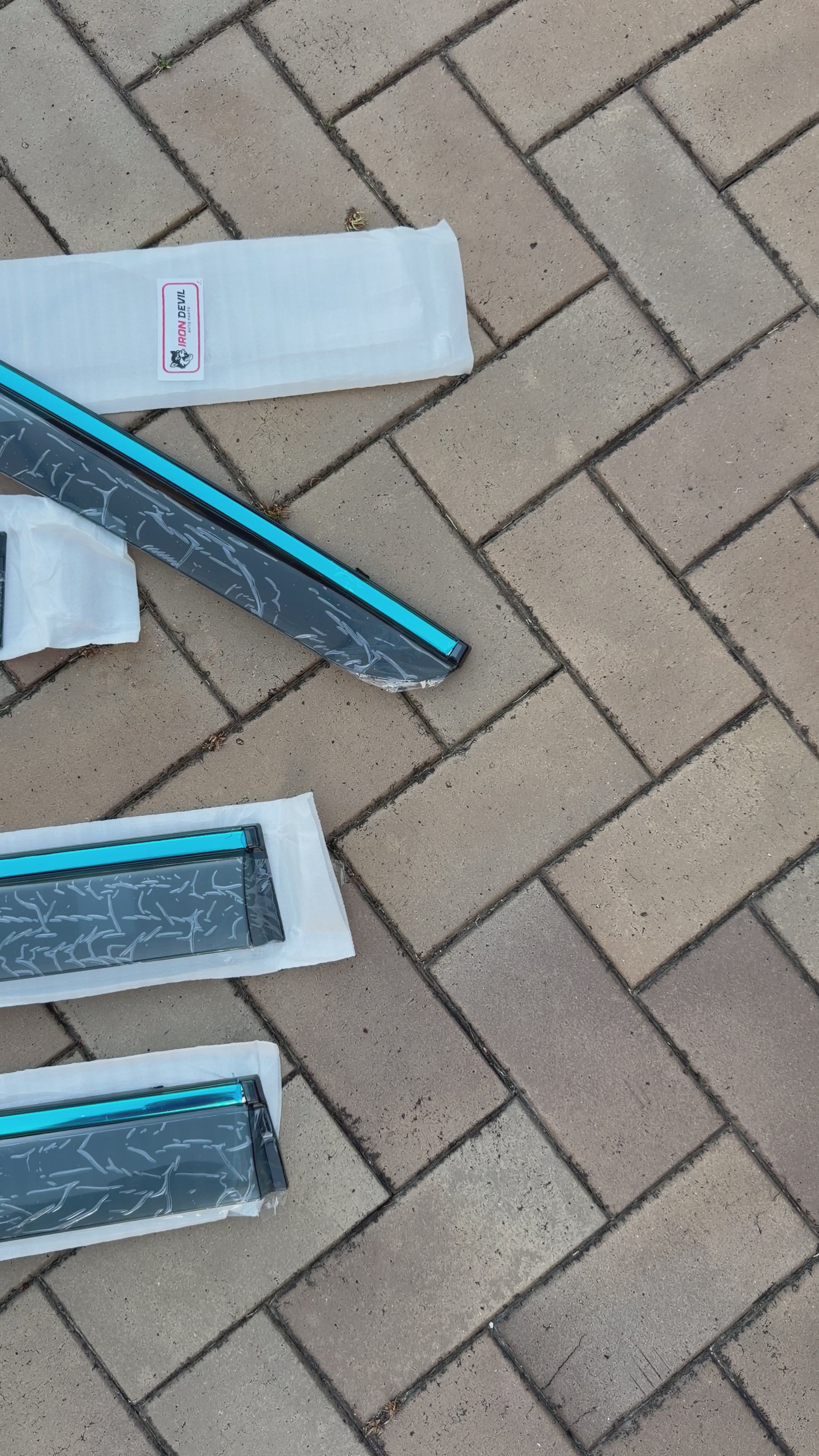 Panning shot 4 BYD Shark 6 window visors Iron Devil Brand on tile