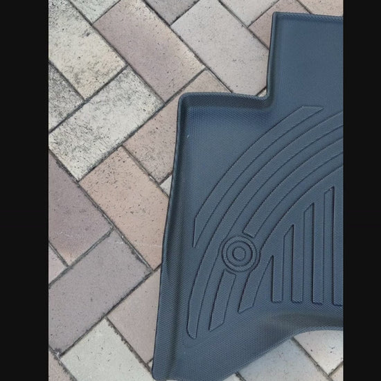 Pan of BYD Shark 6 floor mats on brick Iron Devil brand